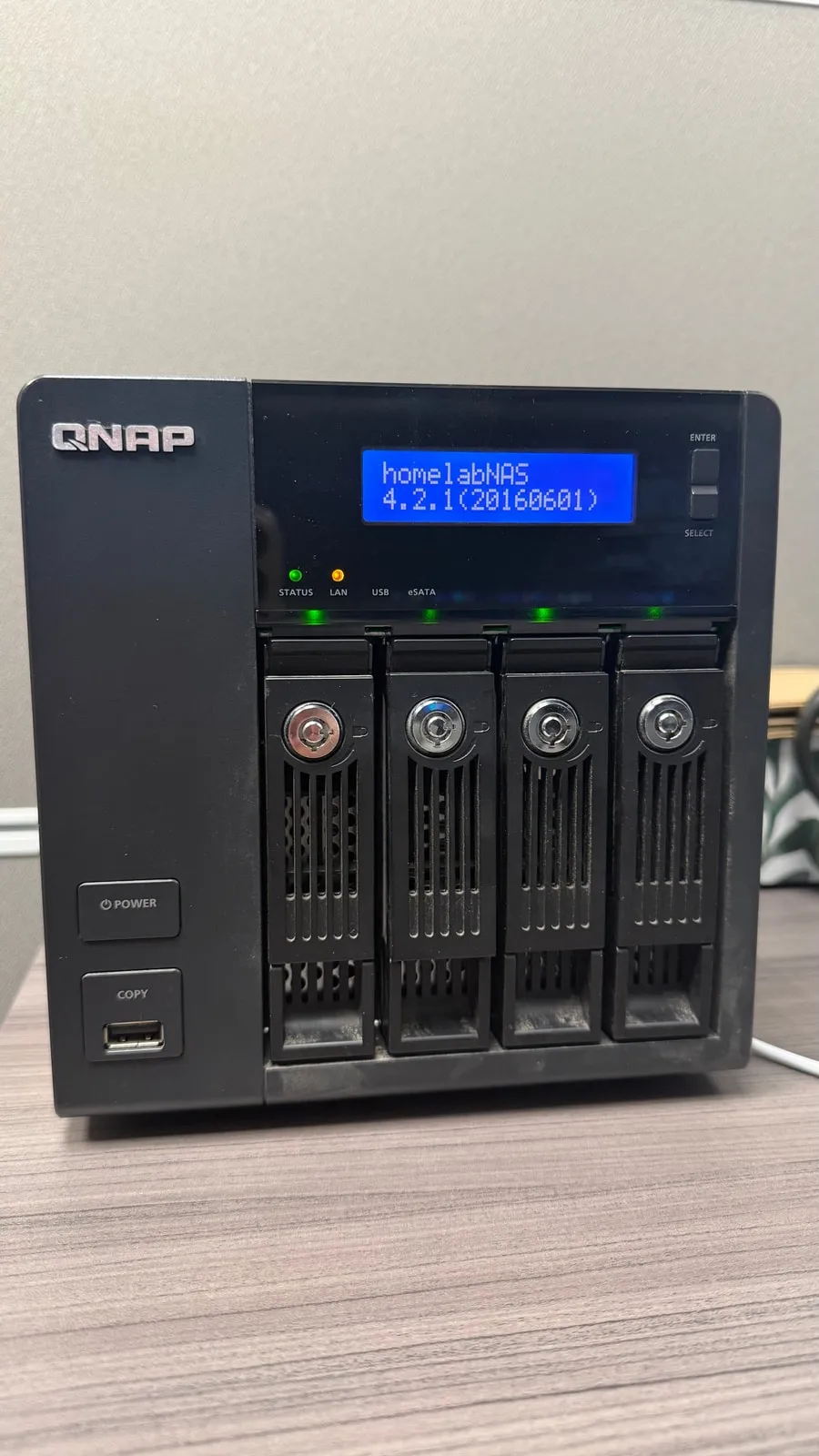QNAP NAS storage unit used as the homelab storage node